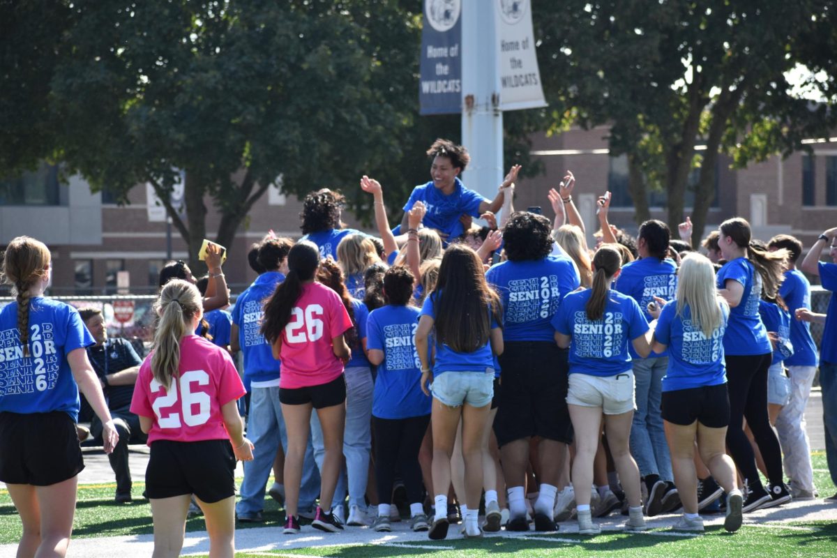 Pep Club members are seen celebrating on Memorial field during the homecoming pep assembly.
