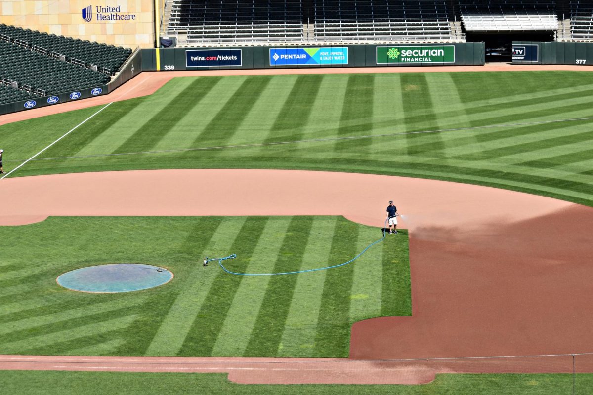 A grounds crew member prepares the field before a game. As the MLB season gets underway, teams across the league are already positioning themselves for a run at the postseason.