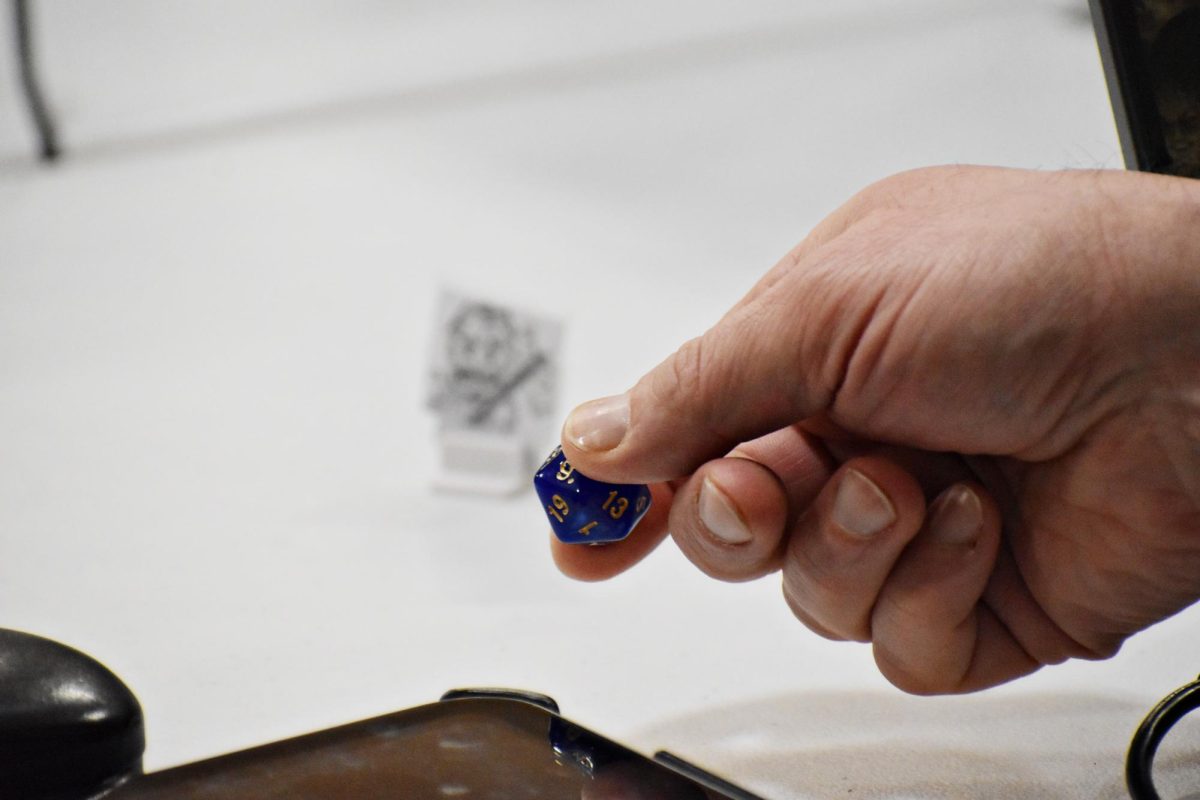 A die is cast on a surface during a game of Dungeons & Dragons on Dec. 12, 2025.