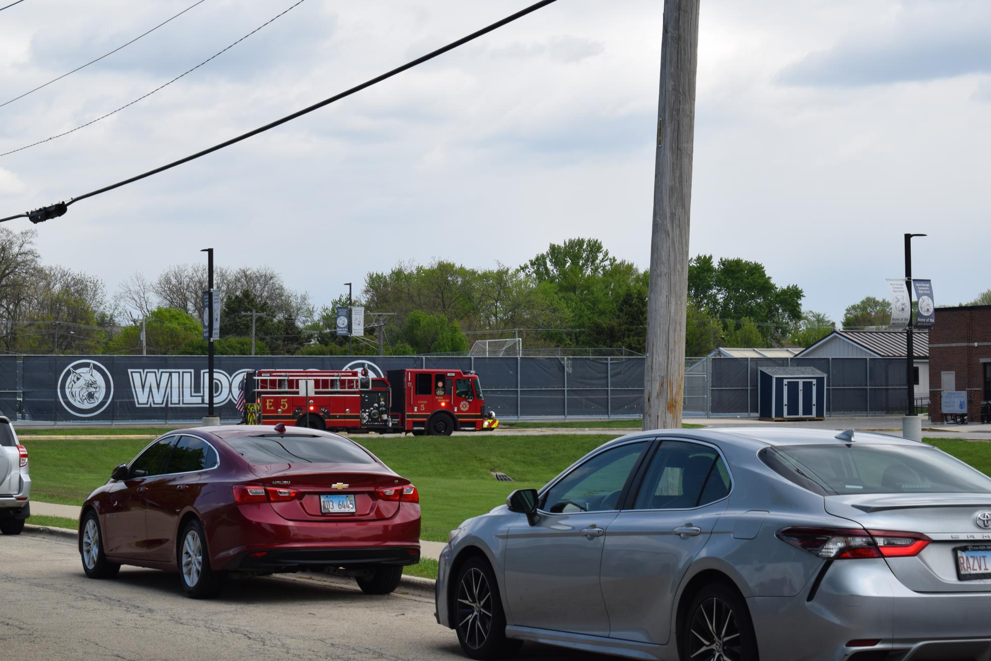 Fire truck drives through the bus lane in front of door 1 at West Chicago Community High School during a fire alarm on April 30. 