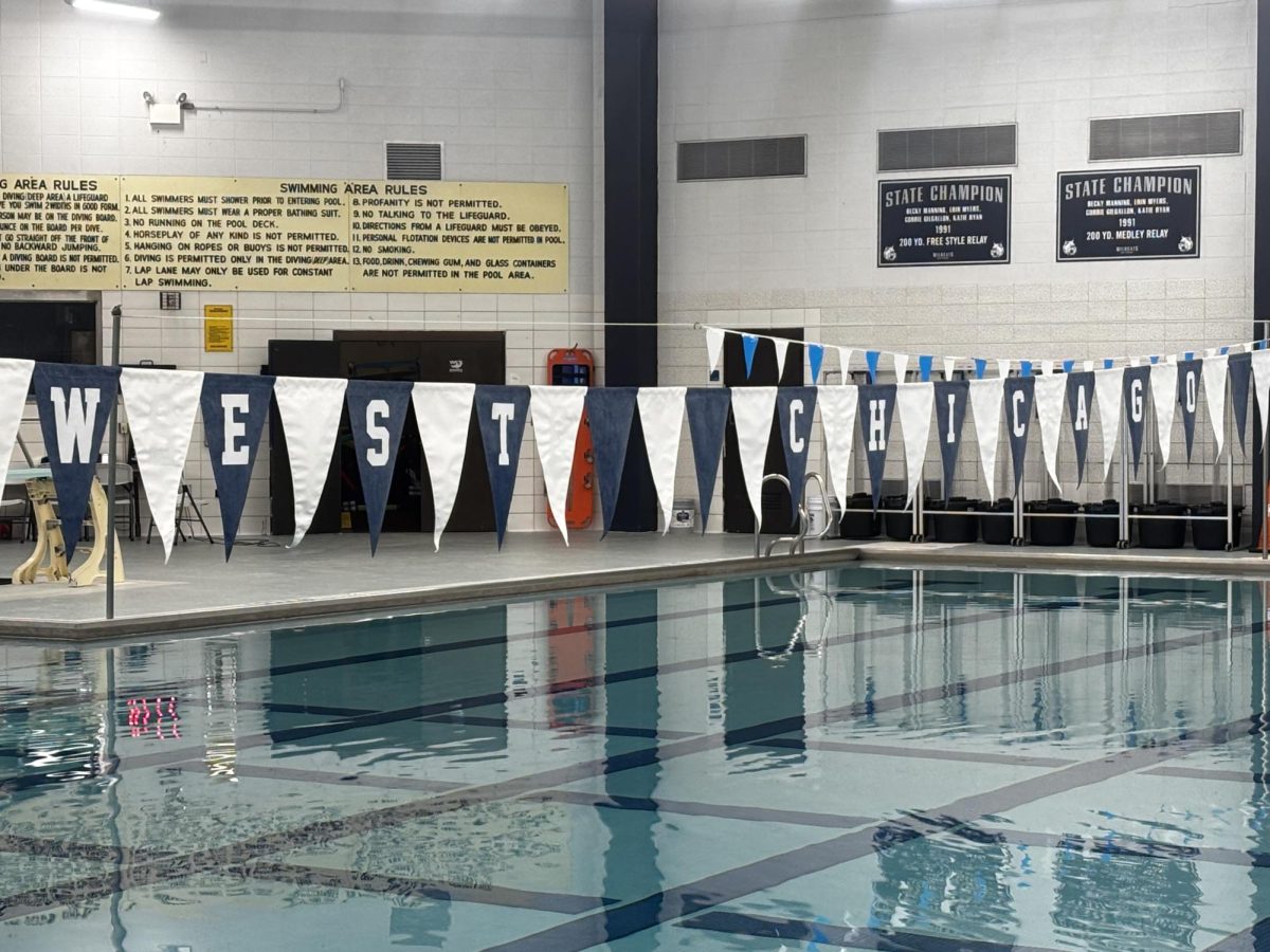 The West Chicago Swimming Pool is decorated with flags that spell out the schools name on April 15.