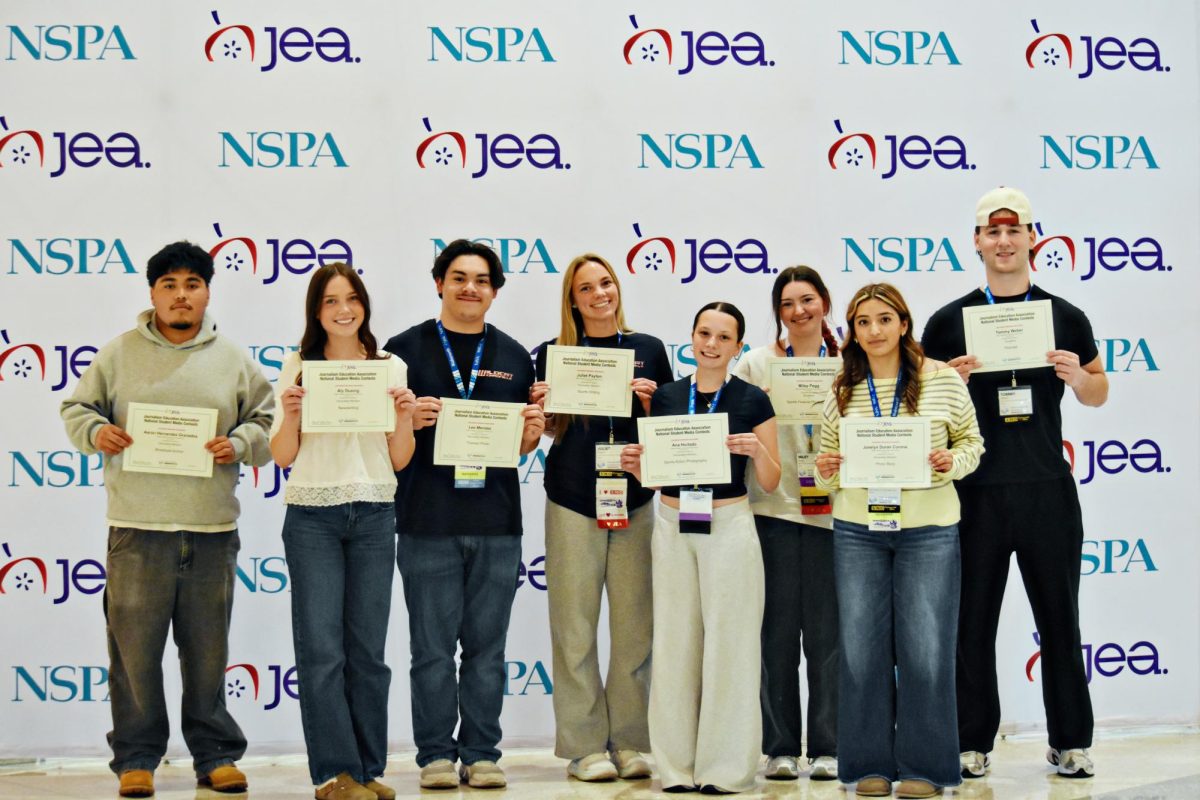 Wildcat Chronicle staff members pose with their awards at the JEA/NSPA National High School Journalism Convention in Minneapolis. Multiple students earned national recognition in the Spring 2026 National Student Media Contest across writing, photography, and broadcast categories. (Photo by Leslie Fireman)