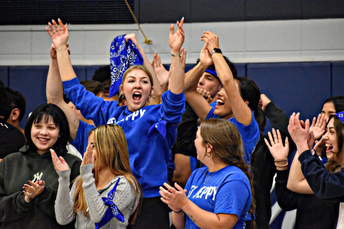 After Katie Mulatz's class won the senior den games, the team erupted in cheers on April 30, 2026 in West Chicago Community High School's Bishop Gym.
