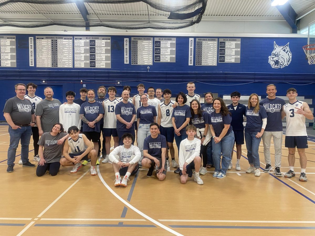 The boys' volleyball team and their nominated teachers smile for a pregame picture in the fieldhouse on May 5, 2026. (Photo courtesy of Regina Pauli)